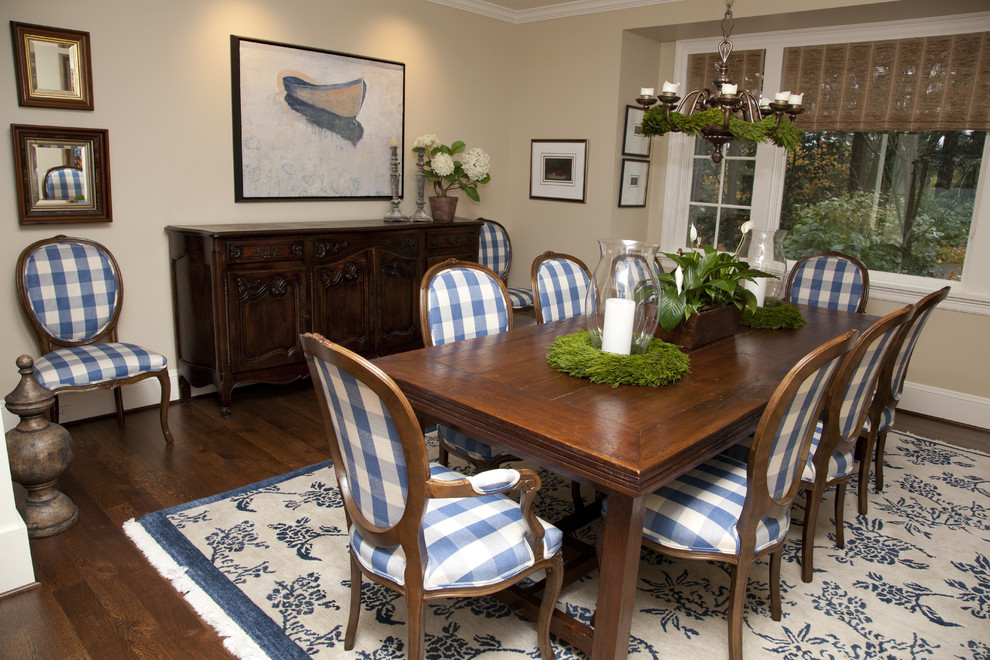 Example of a classic dark wood floor dining room design in Portland with beige walls