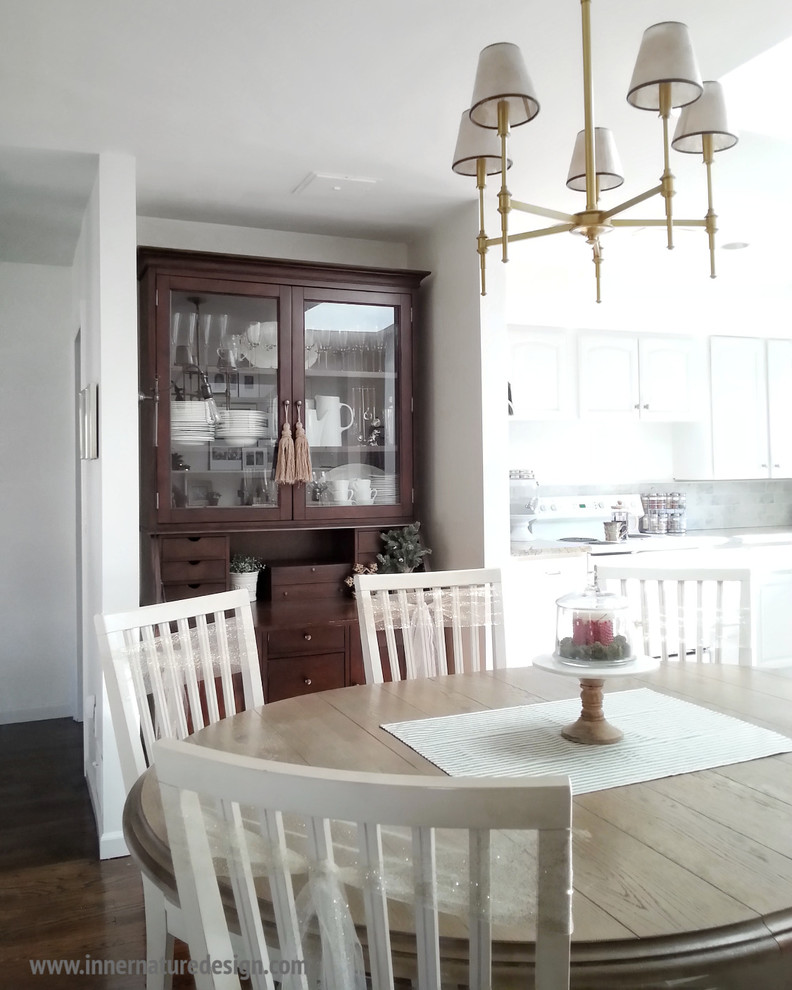 Example of a mid-sized country dark wood floor kitchen/dining room combo design in New York with white walls