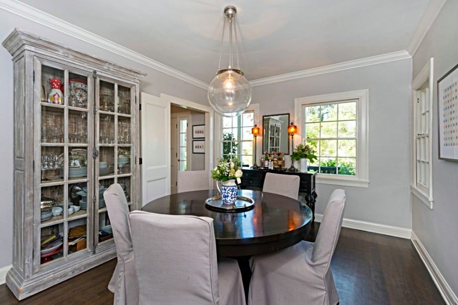 Inspiration for a large classic enclosed dining room in Los Angeles with grey walls and dark hardwood flooring.