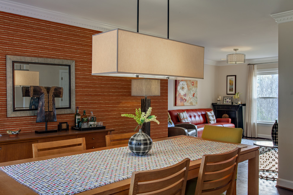 Cette photo montre une salle à manger moderne avec un mur orange.