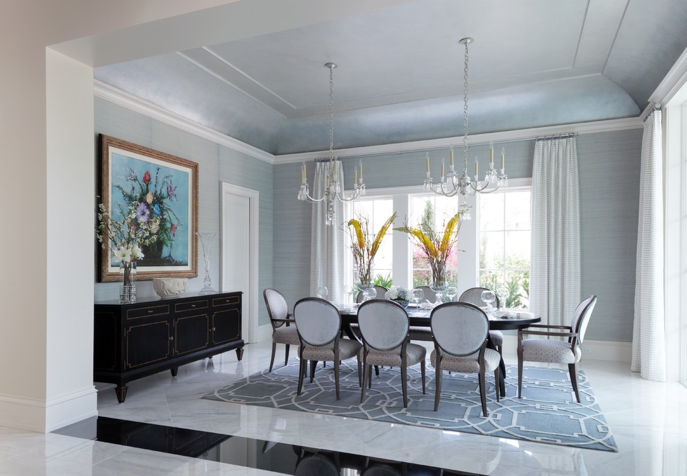 Inspiration for a large contemporary porcelain tile enclosed dining room remodel in Miami with blue walls