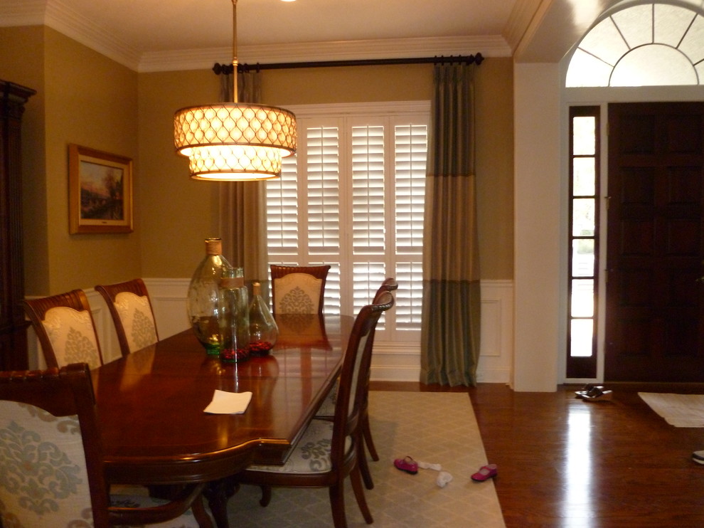 Inspiration for a medium sized classic enclosed dining room in Jacksonville with beige walls, medium hardwood flooring and no fireplace.