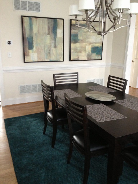 Modern enclosed dining room in Philadelphia with beige walls, medium hardwood flooring and no fireplace.