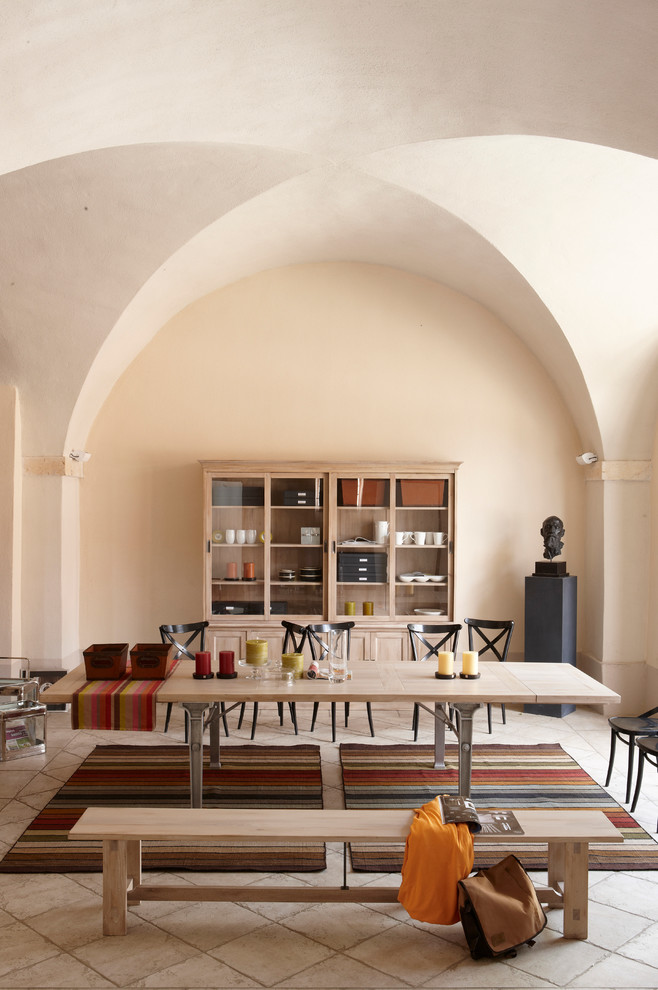 Photo of a mediterranean dining room in New York with beige walls.