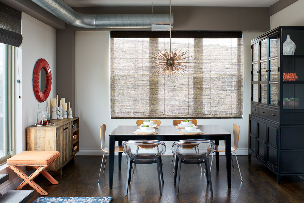 Inspiration for an urban dining room in Chicago with white walls, dark hardwood flooring and brown floors.