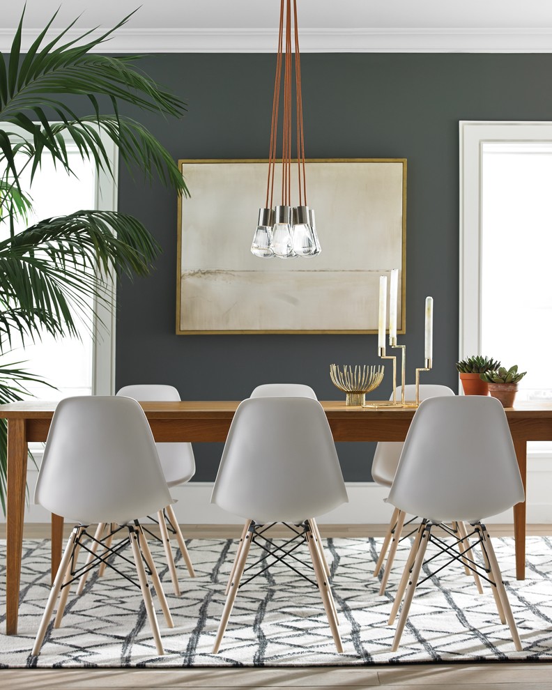Example of a trendy light wood floor dining room design in Montreal with gray walls