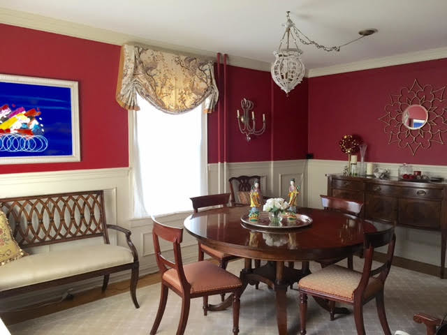 Photo of a medium sized traditional enclosed dining room in New York with red walls and carpet.