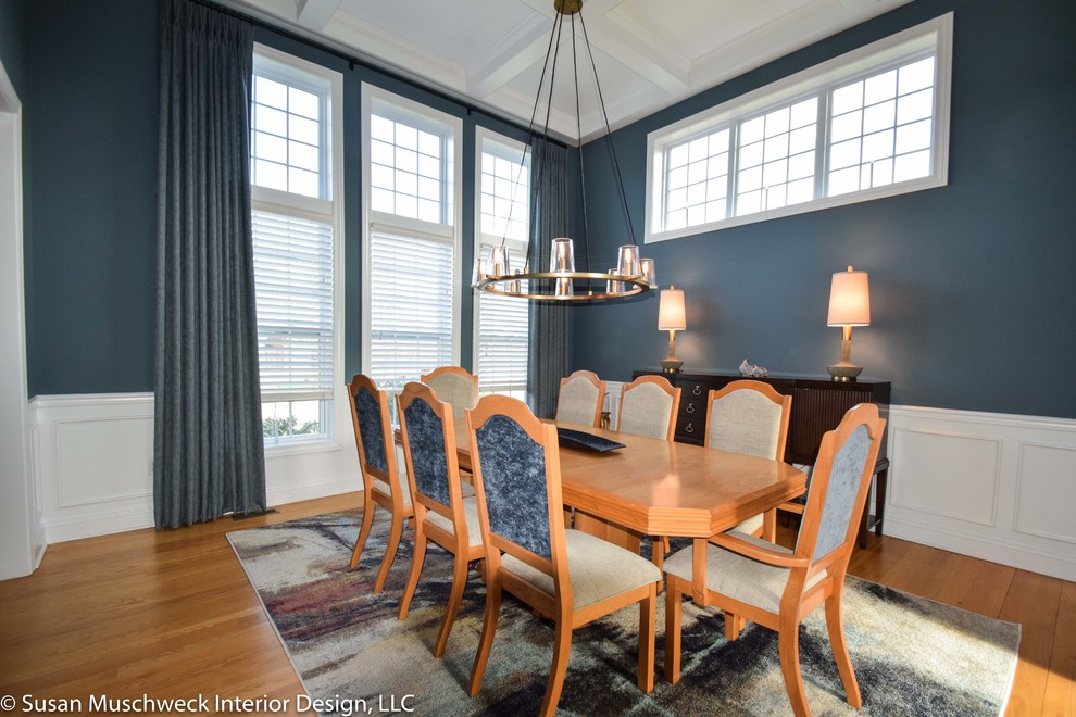 Inspiration for a medium sized classic enclosed dining room in Other with blue walls and light hardwood flooring.