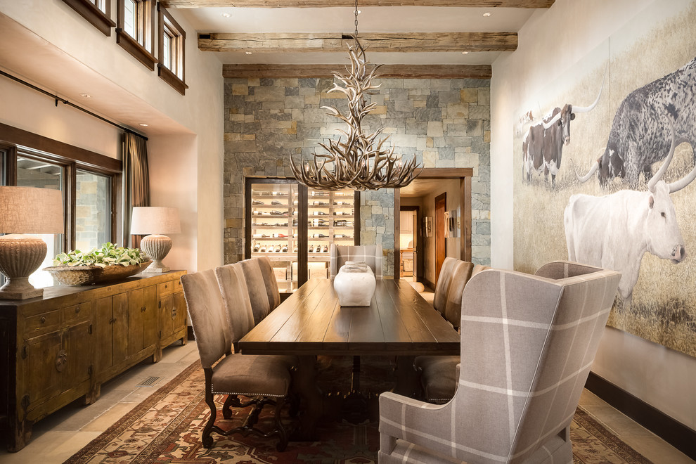 Inspiration for a rustic enclosed dining room in Boise with beige walls and grey floors.