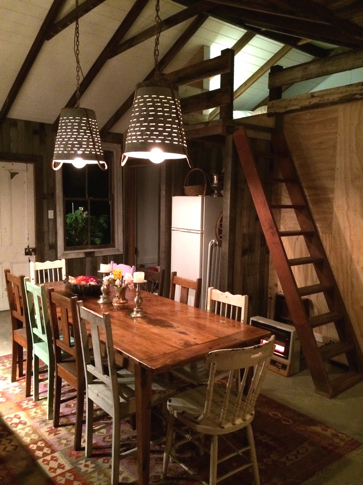 This is an example of a small rustic dining room in Sydney.