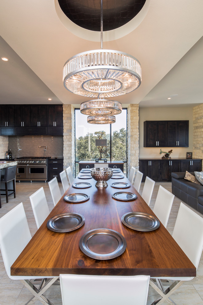 Inspiration for a contemporary dining room remodel in Austin with beige walls