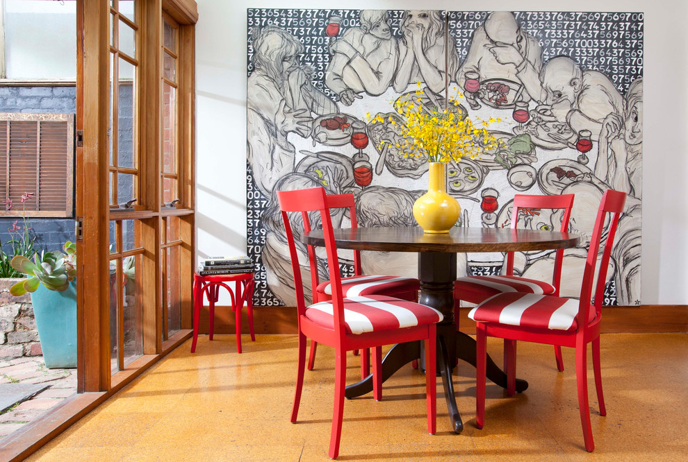 Small contemporary dining room in Melbourne with white walls, cork flooring and brown floors.