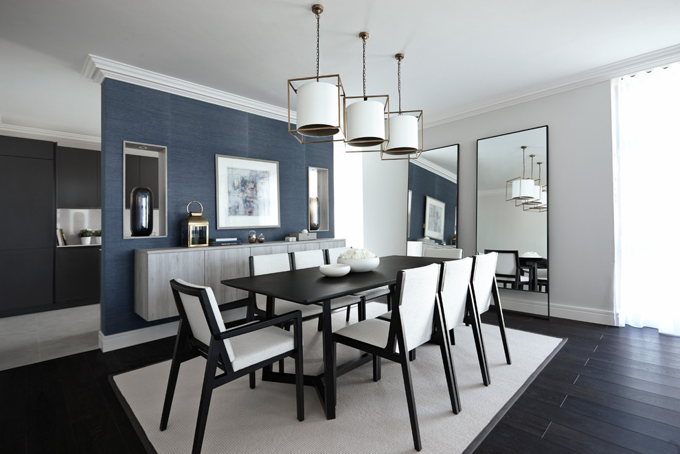 Inspiration for a contemporary dining room in London with blue walls and dark hardwood flooring.