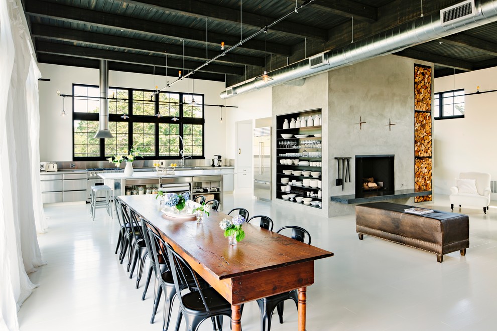 Great room - industrial white floor great room idea in Portland with beige walls
