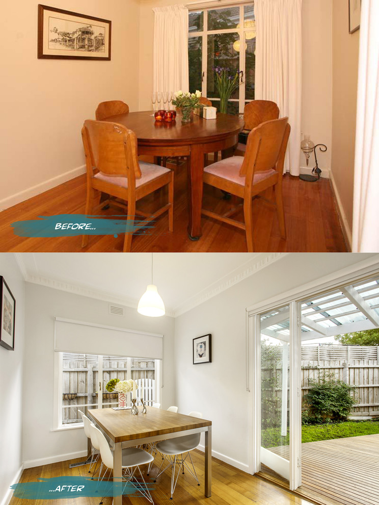 Small modern enclosed dining room in Melbourne with grey walls and medium hardwood flooring.