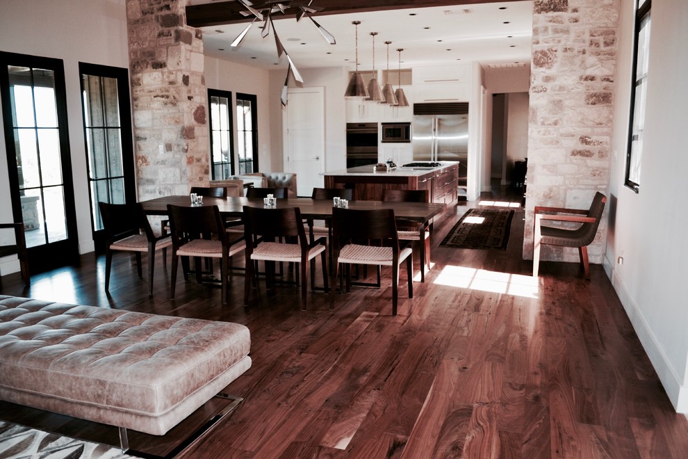Photo of a large modern kitchen/dining room in Austin with dark hardwood flooring.