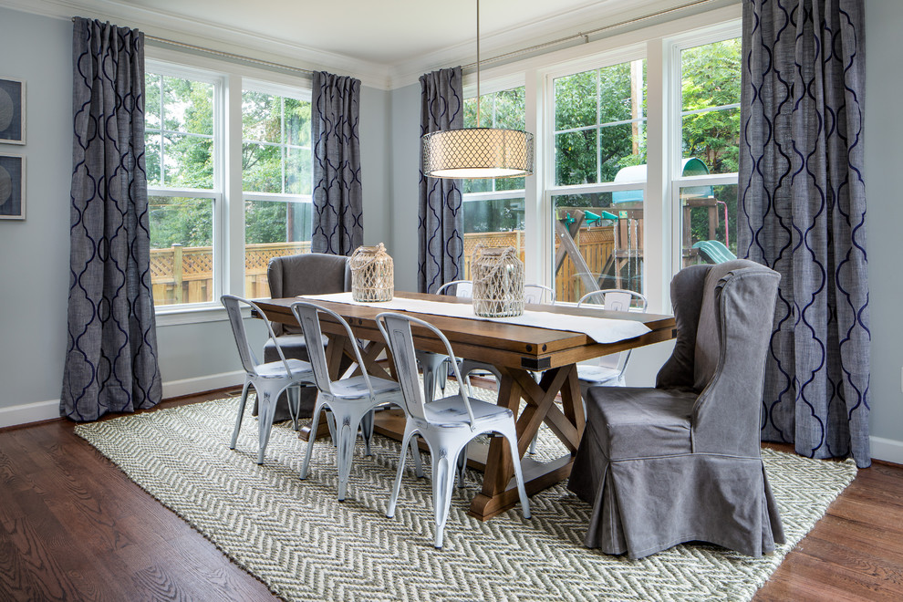 Inspiration for a country open plan dining room in DC Metro with blue walls, medium hardwood flooring and brown floors.