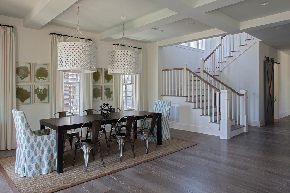 Beach style open plan dining room in Miami with white walls and light hardwood flooring.
