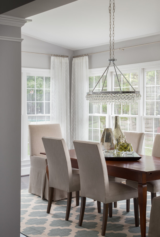 This is an example of a large classic dining room in DC Metro with grey walls.