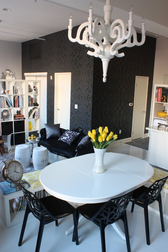 Dining room - eclectic vinyl floor dining room idea in Los Angeles with black walls