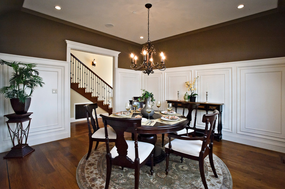 Classic dining room in San Francisco with brown walls and dark hardwood flooring.
