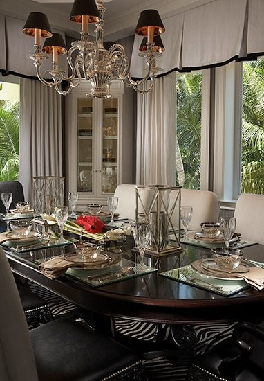 Enclosed dining room - mid-sized contemporary enclosed dining room idea in Miami with beige walls and no fireplace