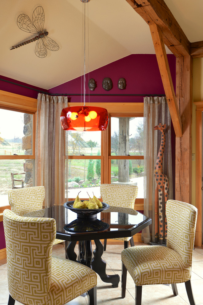 This is an example of an eclectic dining room in Dallas with purple walls.