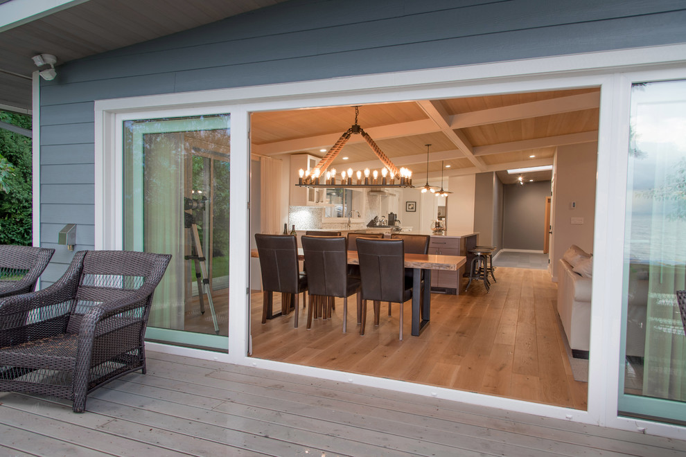 This is an example of a beach style dining room in Vancouver.