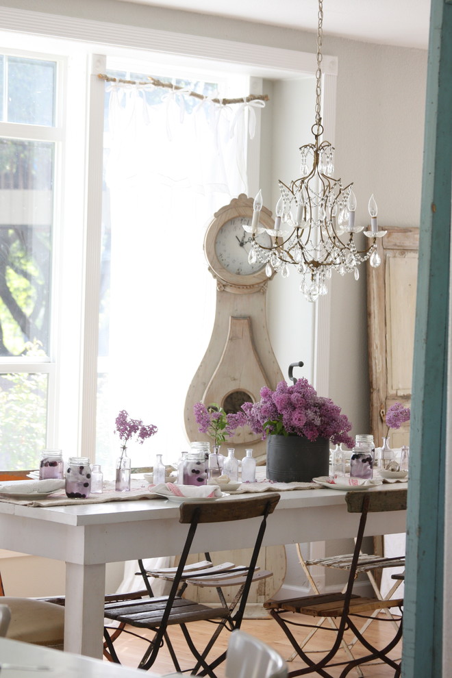 Example of a cottage chic dining room design in Other with gray walls