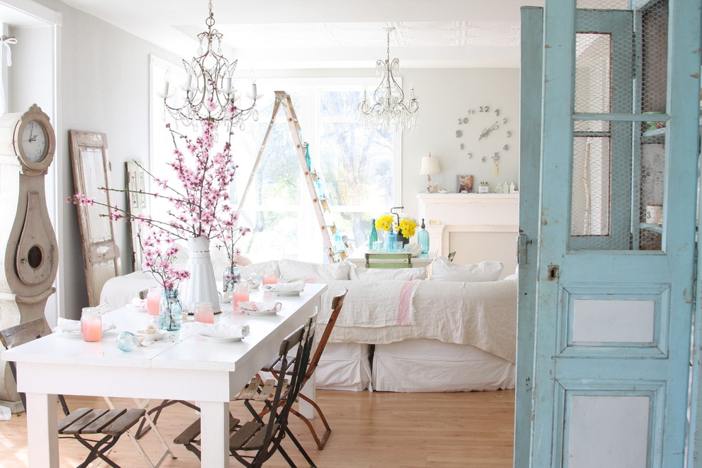 Dining room - shabby-chic style medium tone wood floor dining room idea in Other with gray walls