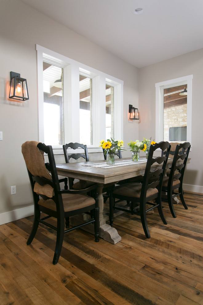 Dining room - farmhouse medium tone wood floor dining room idea in Austin with beige walls