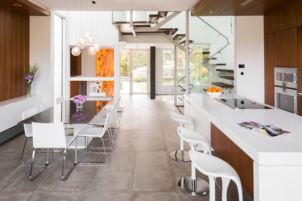Inspiration for a mid-sized contemporary concrete floor great room remodel in Vancouver with white walls