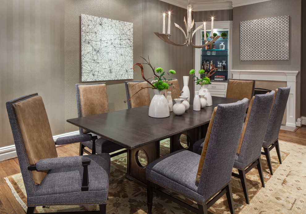 Inspiration for a large transitional medium tone wood floor and brown floor enclosed dining room remodel in DC Metro with a standard fireplace, beige walls and a stone fireplace