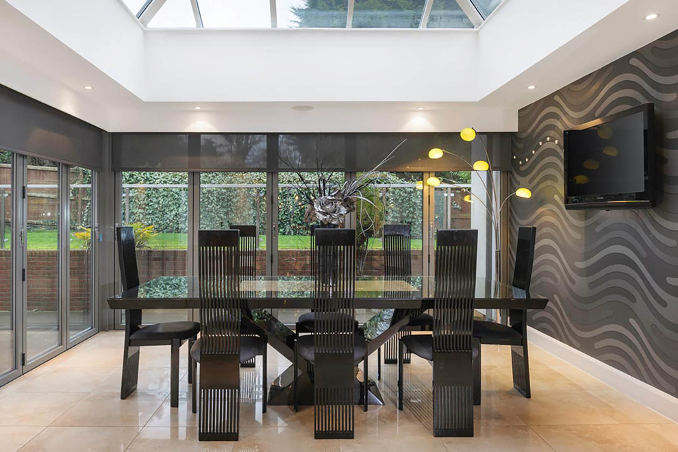 Medium sized contemporary enclosed dining room in Other with grey walls and beige floors.