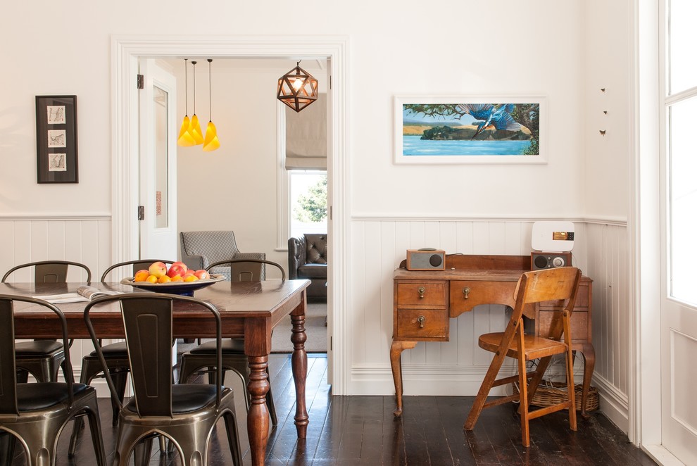 Example of a transitional dark wood floor kitchen/dining room combo design in Auckland with white walls