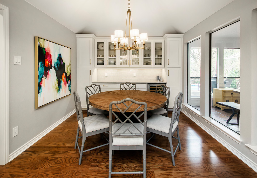 This is an example of a small classic kitchen/dining room in Dallas with grey walls, medium hardwood flooring and brown floors.