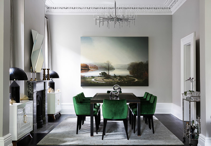 This is an example of a classic dining room in Sydney with feature lighting.