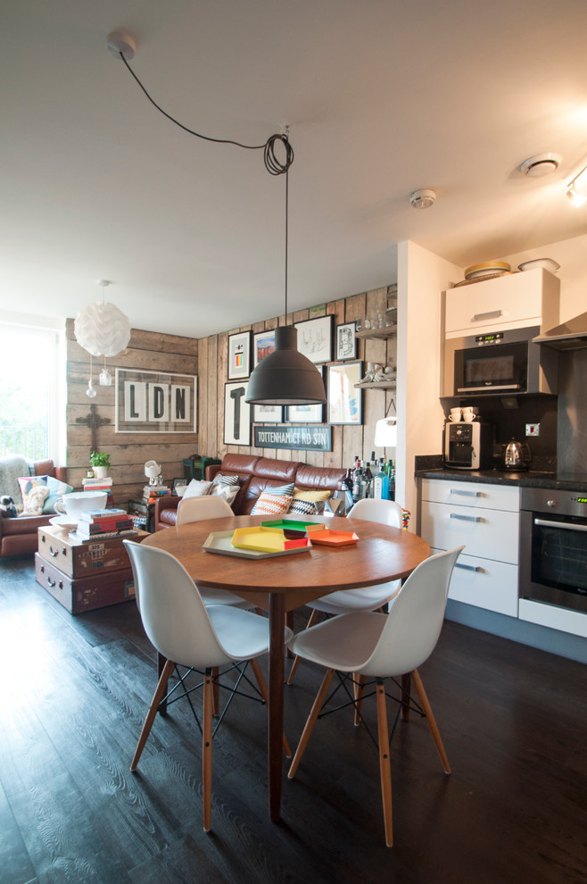 Example of a mid-sized eclectic kitchen/dining room combo design in London
