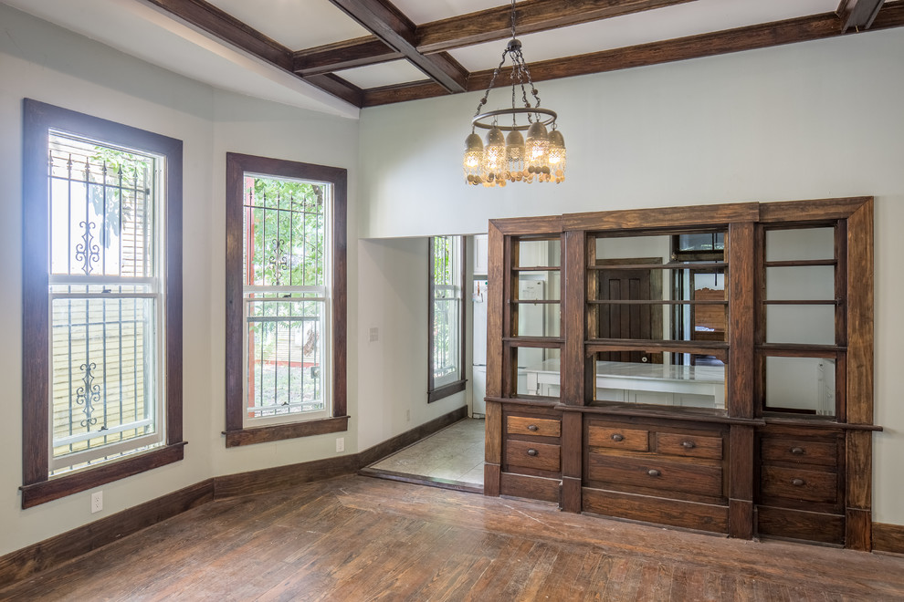 Mid-sized elegant dark wood floor and brown floor enclosed dining room photo in Austin with white walls and no fireplace
