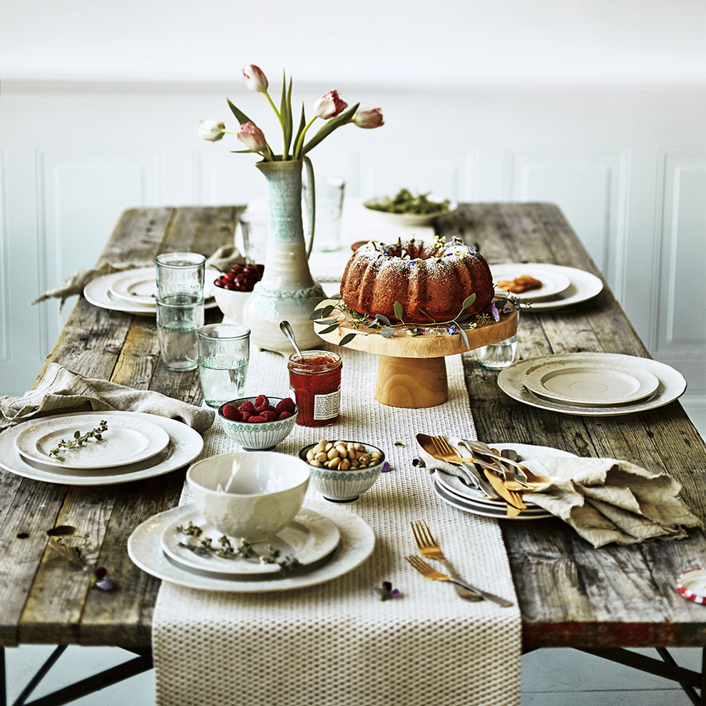 Example of a mountain style dining room design in London