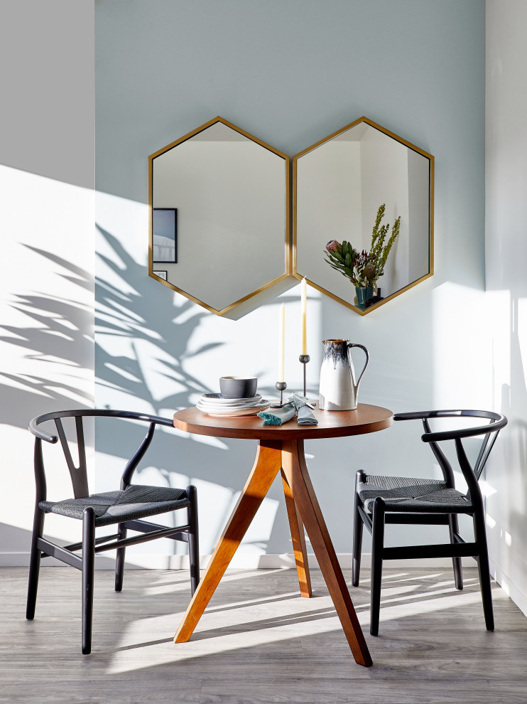 Small retro kitchen/dining room in San Francisco with blue walls, vinyl flooring and grey floors.