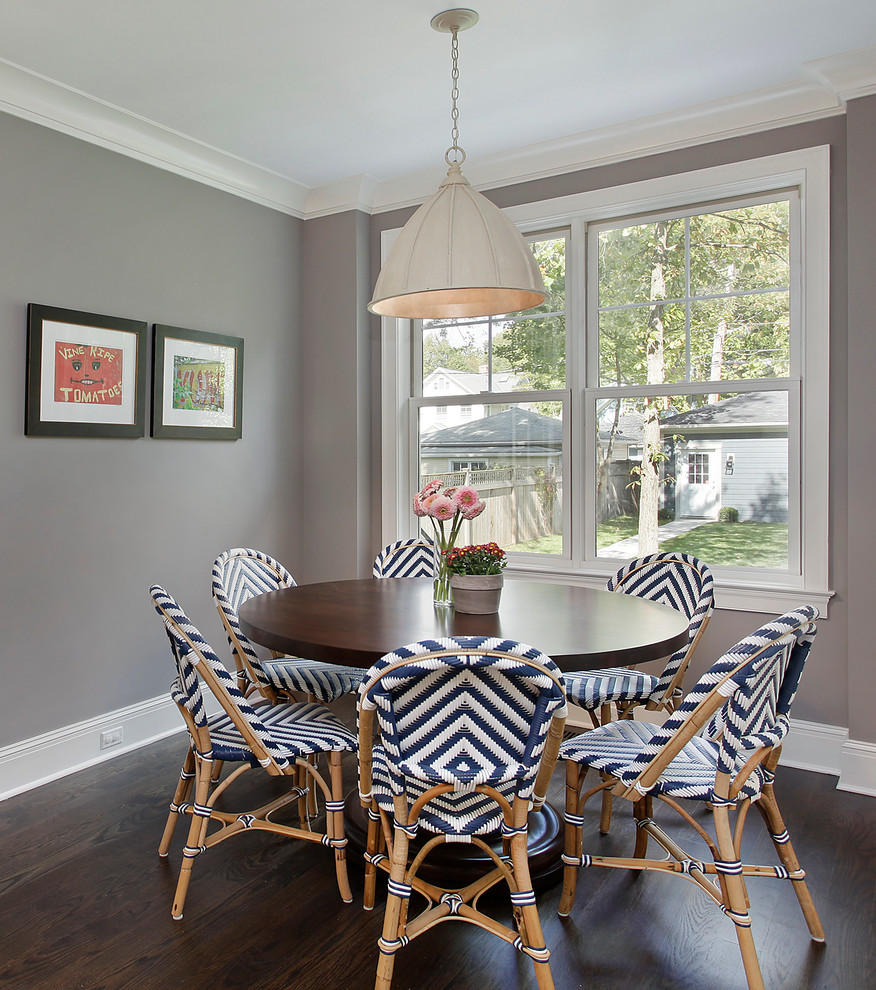 Example of a mid-sized transitional dark wood floor dining room design in Chicago with gray walls