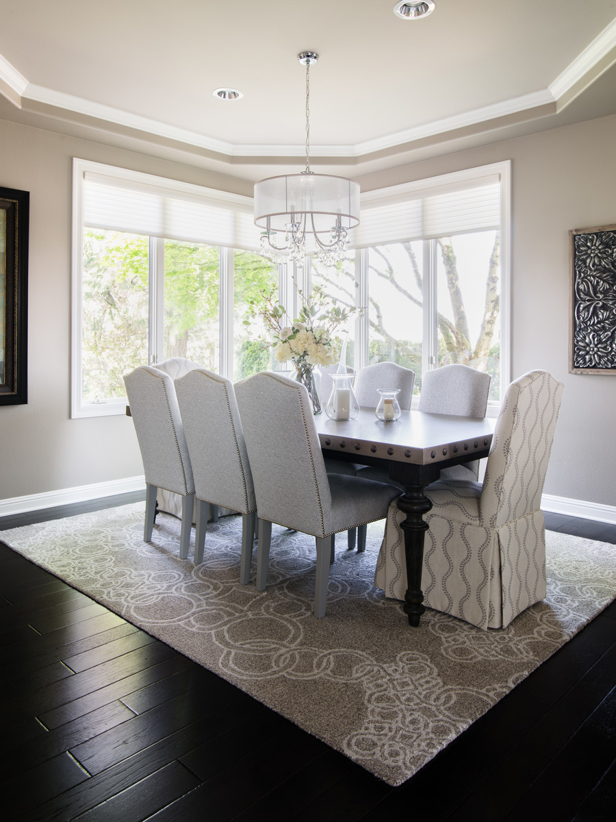 This is an example of a medium sized classic dining room in Seattle with grey walls, dark hardwood flooring, no fireplace and brown floors.