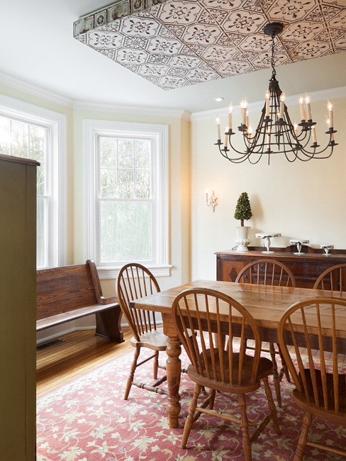 Example of a mid-sized country light wood floor and brown floor kitchen/dining room combo design in Philadelphia with beige walls and no fireplace