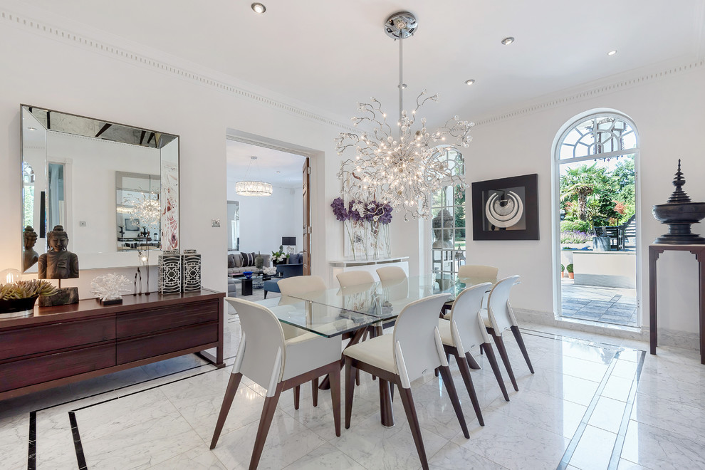Design ideas for an eclectic enclosed dining room in Hertfordshire with white walls and grey floors.