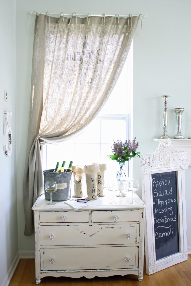 This is an example of a shabby-chic style dining room in Chicago.