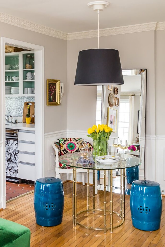 Eclectic medium tone wood floor dining room photo in DC Metro with gray walls