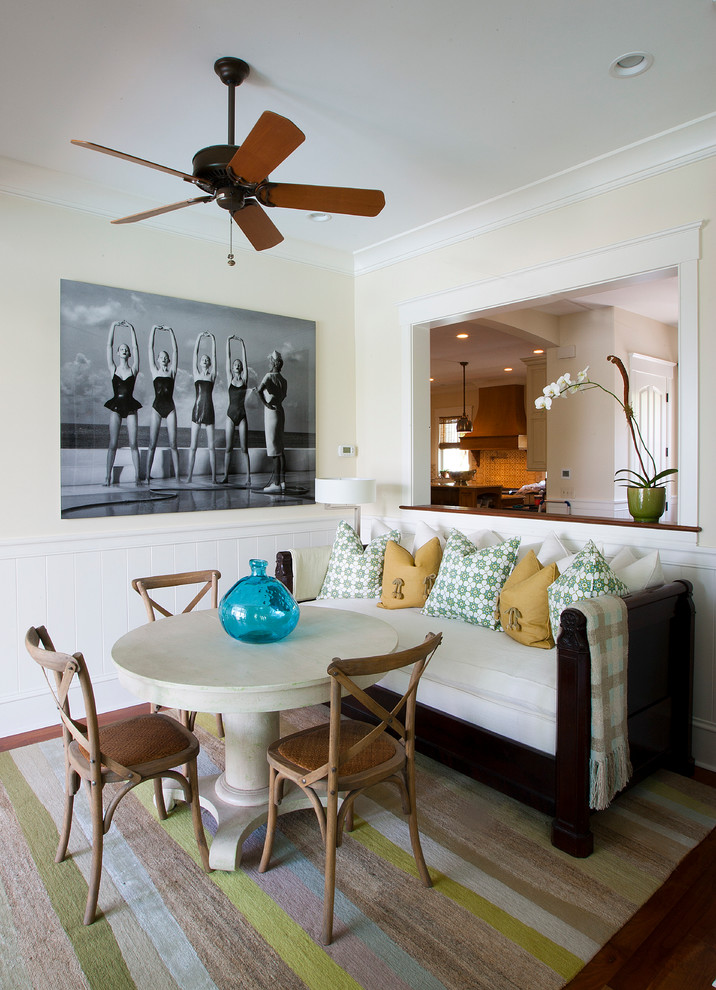 Photo of a bohemian dining room in Charleston with beige walls and dark hardwood flooring.