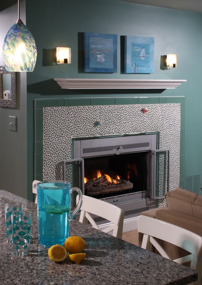 Foto de comedor ecléctico con marco de chimenea de baldosas y/o azulejos