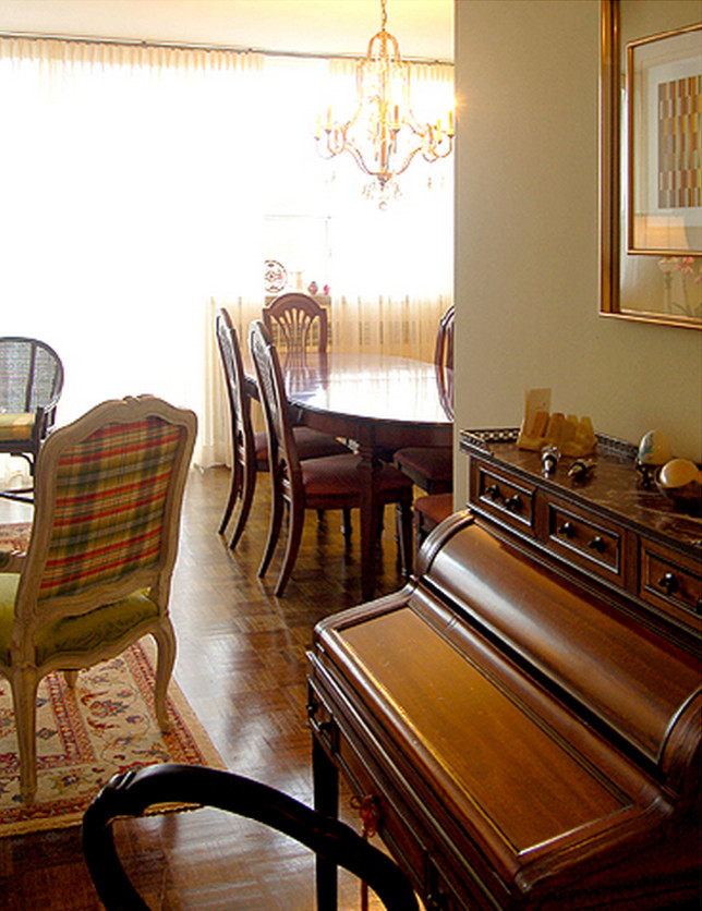 Inspiration for a timeless medium tone wood floor dining room remodel in Toronto with beige walls